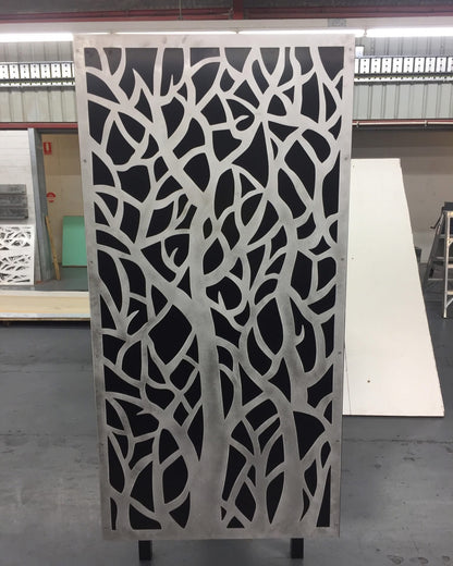 Galvanised steel privacy screen with laser-cut decorative pattern, providing outdoor privacy and a contemporary design feature for gardens and patios.