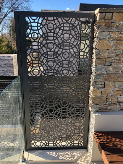 Powder-coated steel privacy screen with laser-cut decorative pattern, providing outdoor privacy and a contemporary design feature for gardens and patios.