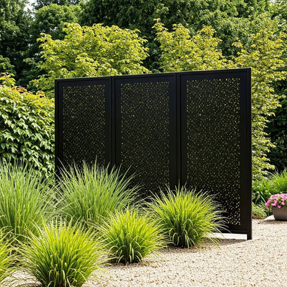 Powder-coated steel privacy screens in a backyard setting, providing a striking focal point and effective outdoor privacy for modern garden landscapes.